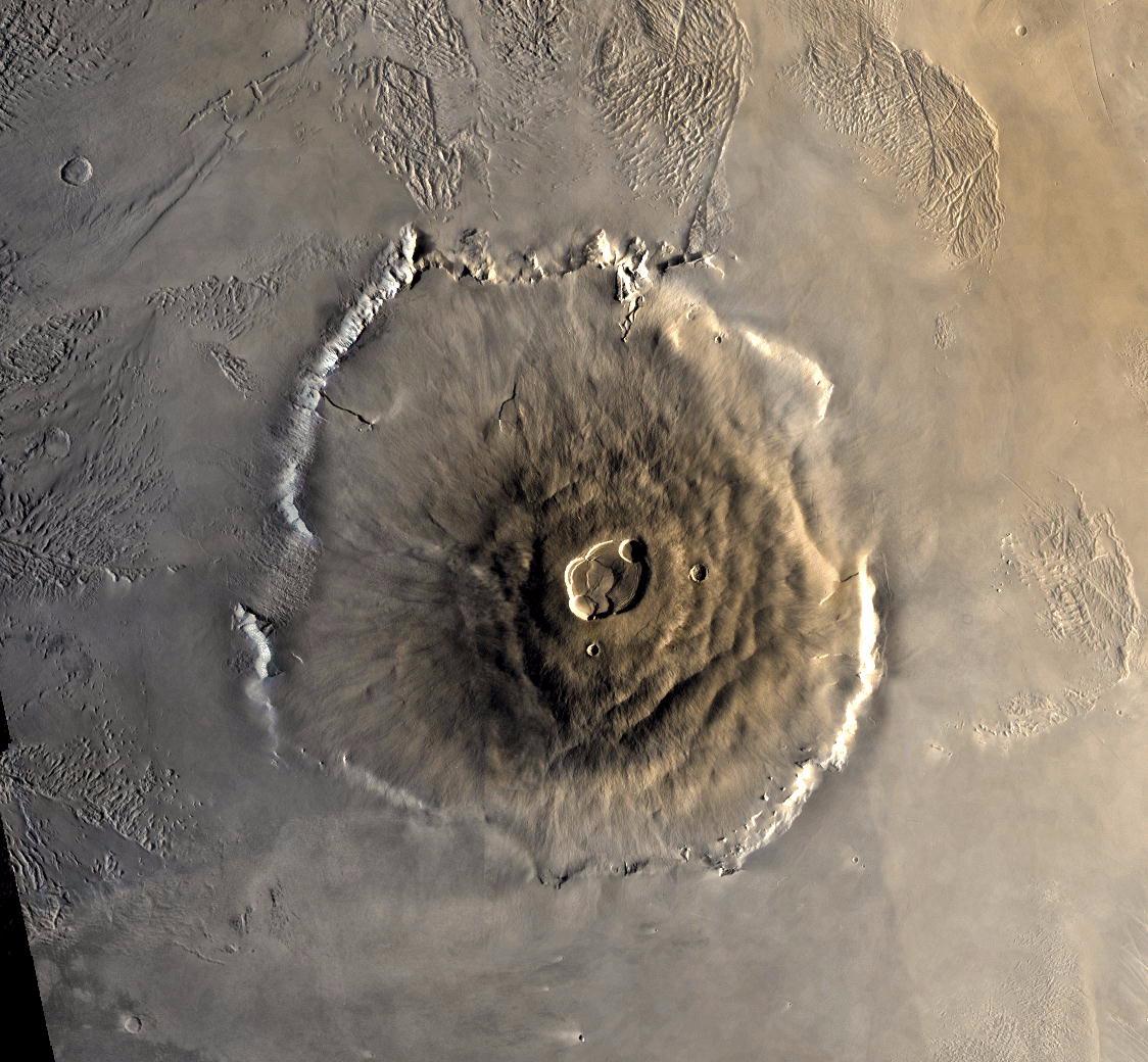 Olympus Mons on Mars, a vast shield volcano rising from the Tharsis plains. Viking color mosaic.